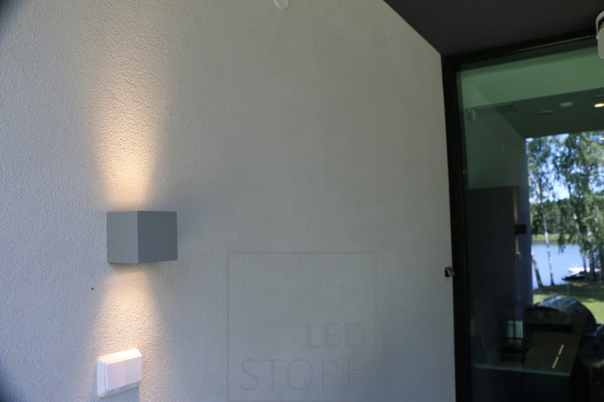 CUBIC OUT bi-directional wall luminaire.